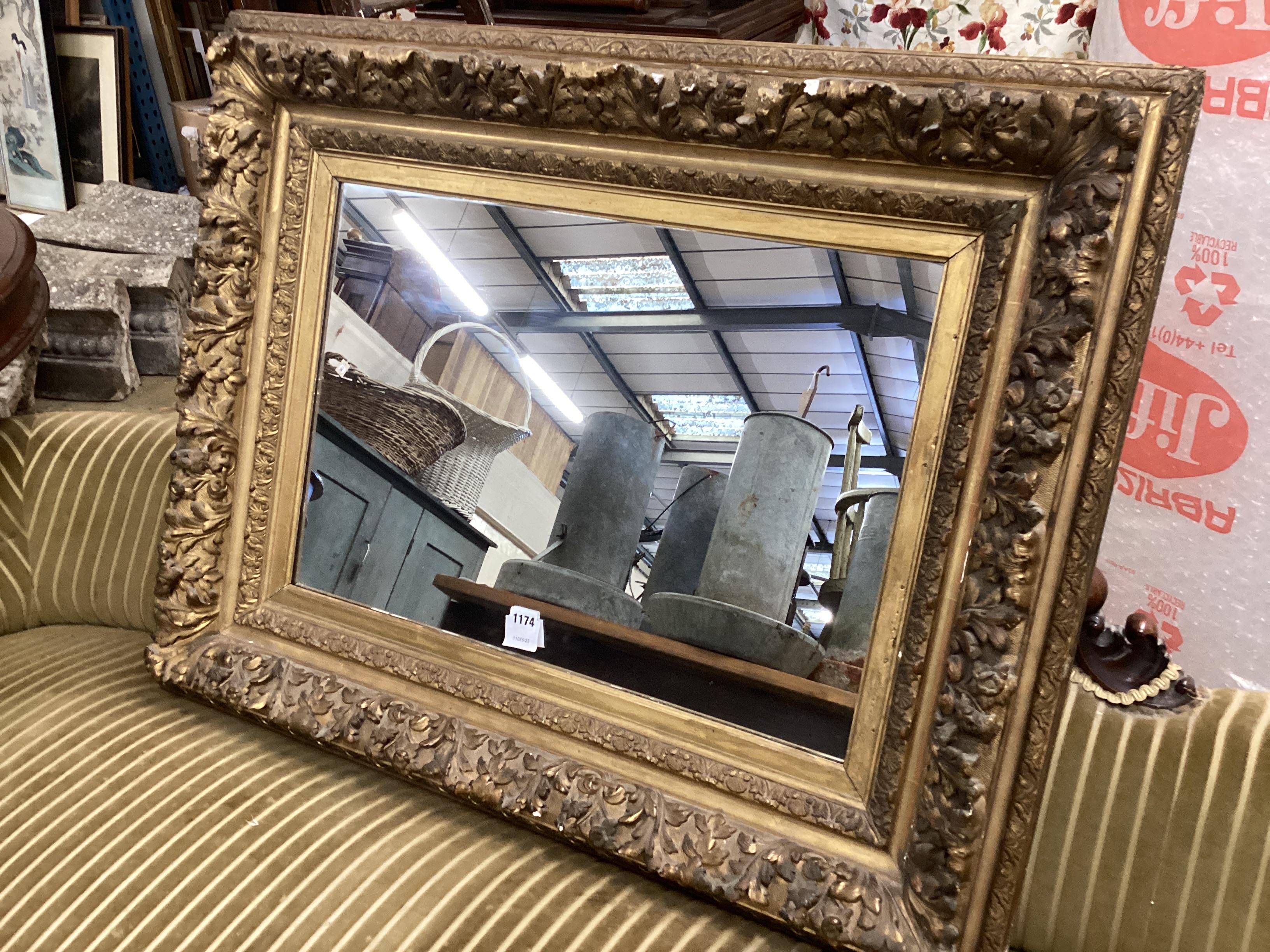 A Victorian giltwood and composition rectangular wall mirror, width 96cm, height 76cm (aperture 63 x 44cm)